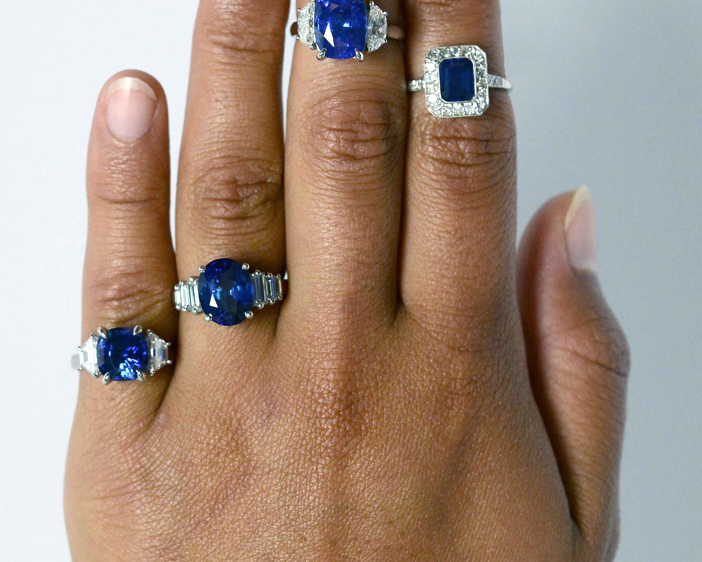 Dark blue sapphire engagement rings with diamonds.