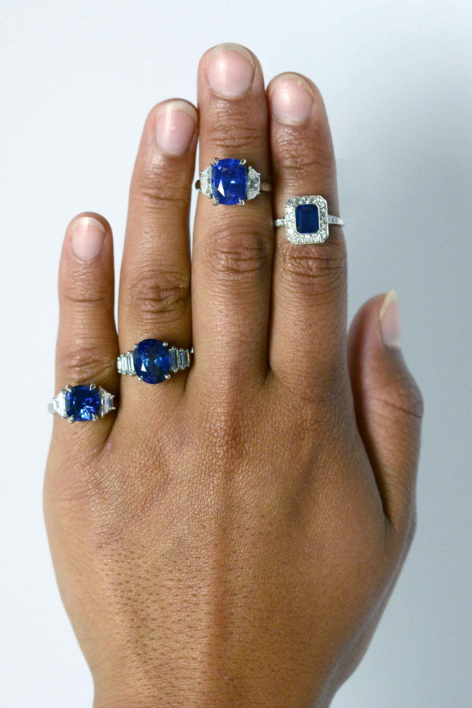 Dark blue sapphire engagement rings with diamonds.