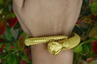 An Etruscan style, heavy heirloom gold bracelet.