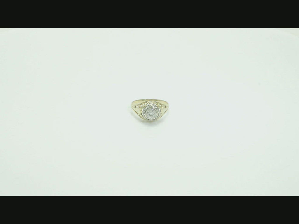 A half carat old mine brilliant diamond with large facets in an Art Nouveau design from 1910.