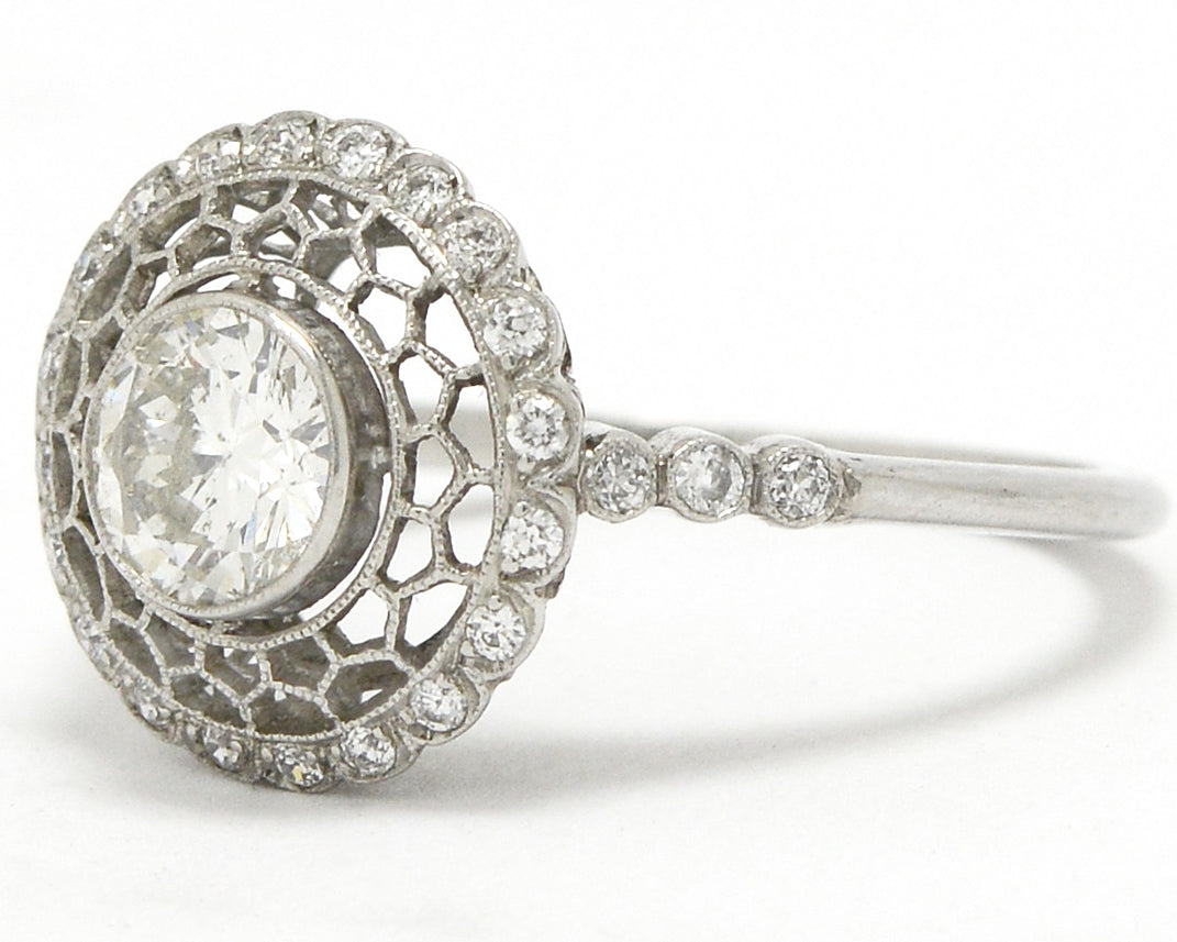 Unique lace filigree diamond engagement ring.
