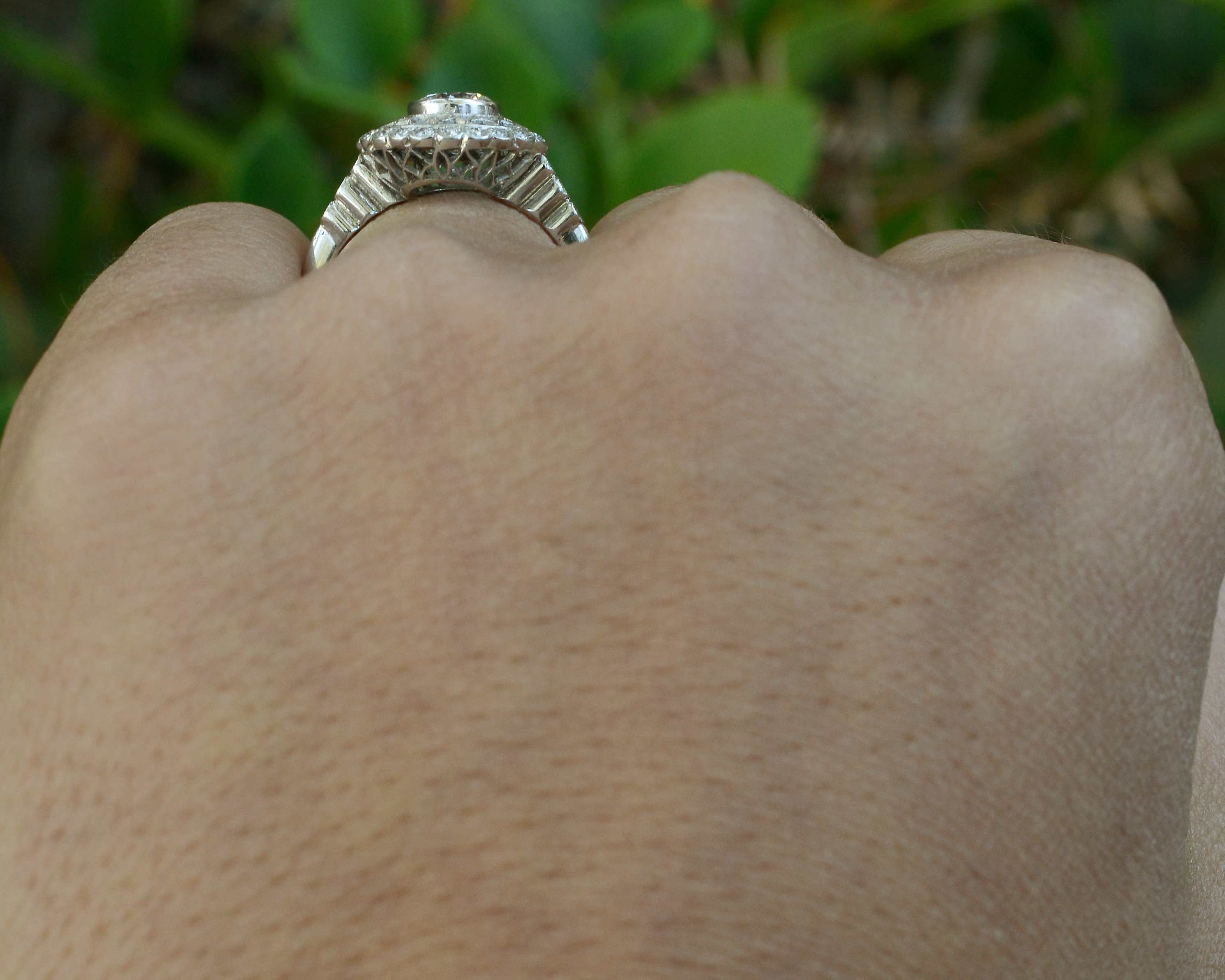 Webbed filigree and stepped tapered diamond band.