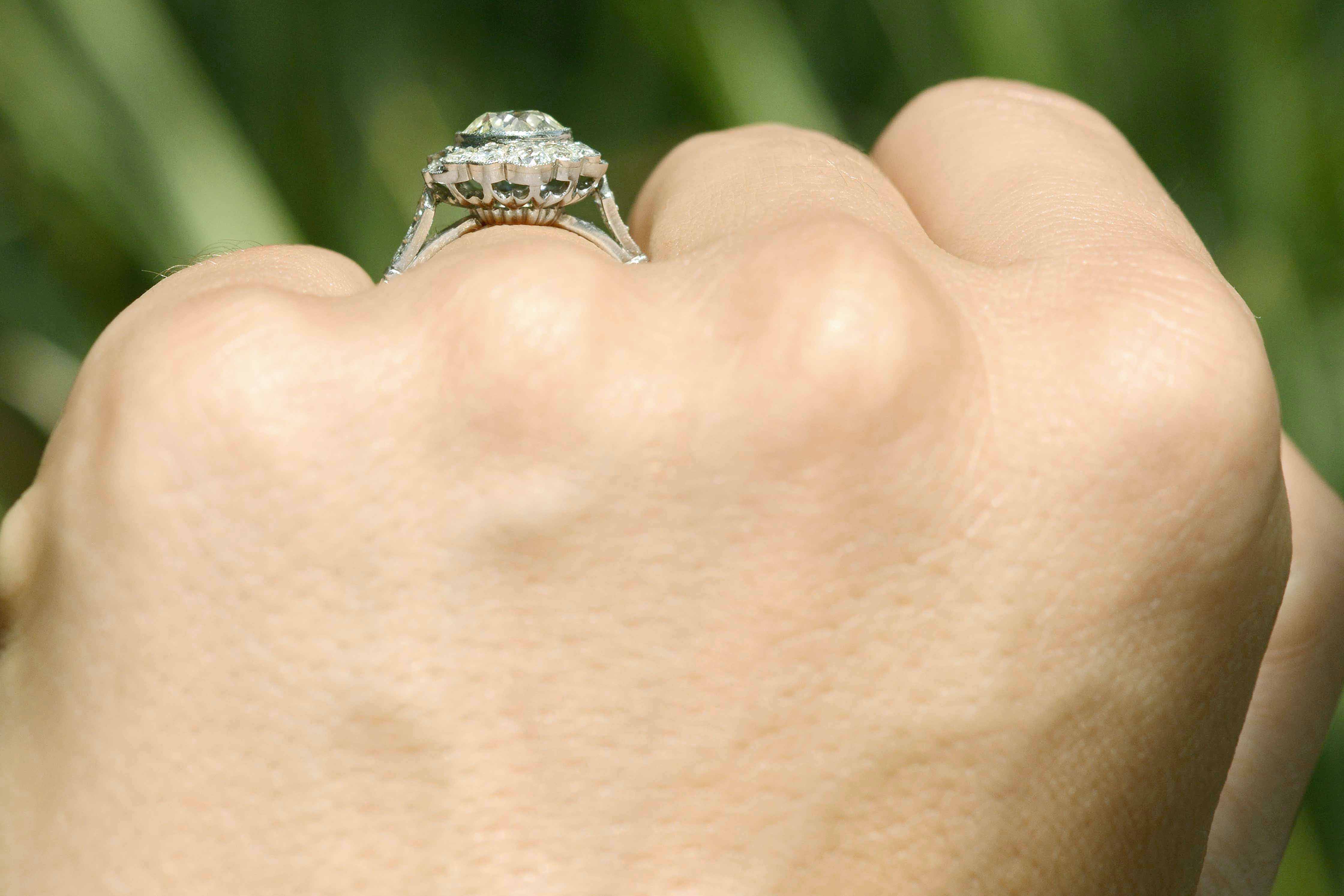 A cluster floral filigree diamond ring.