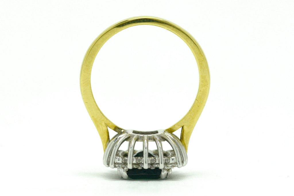 A white and yellow gold modern green tourmaline ring.