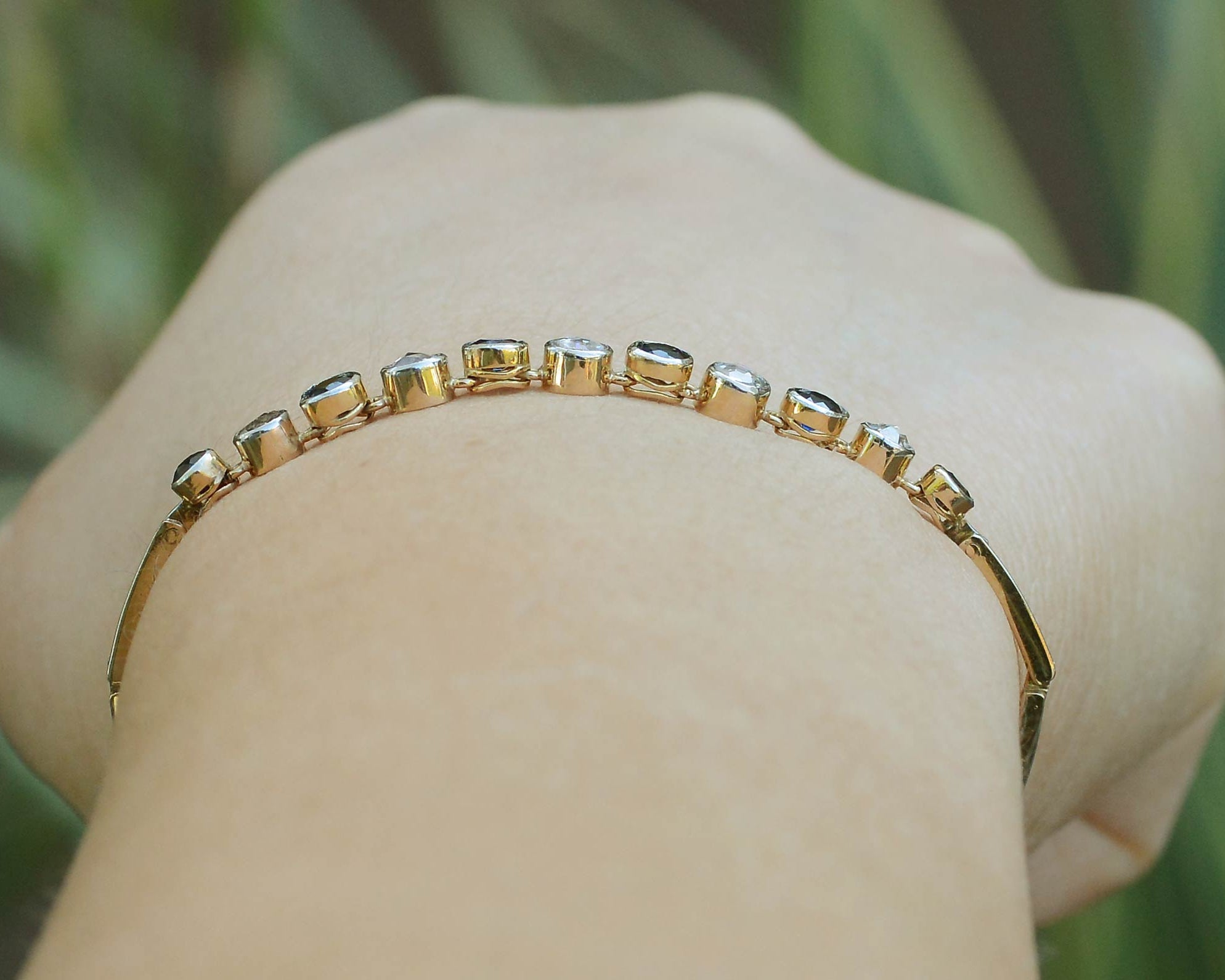 Distinguishable, alternating gems, each set in their own collet in this line bracelet.