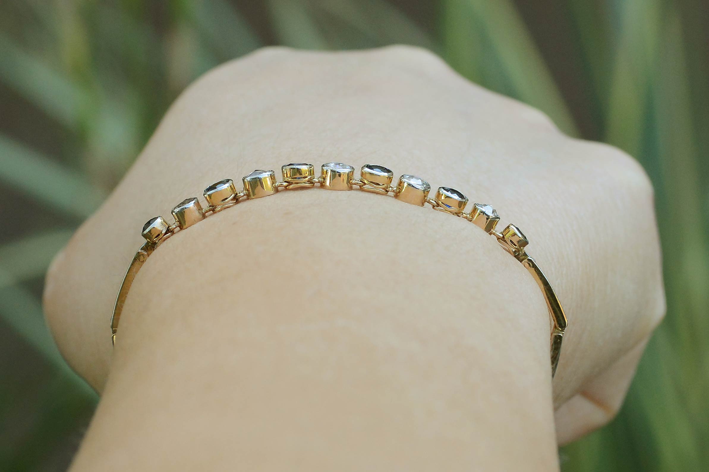 Distinguishable, alternating gems, each set in their own collet in this line bracelet.
