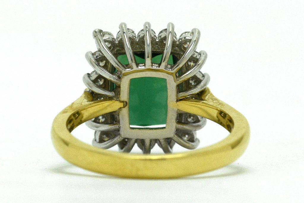 A large, 3 carat green tourmaline in a white gold basket ring setting.