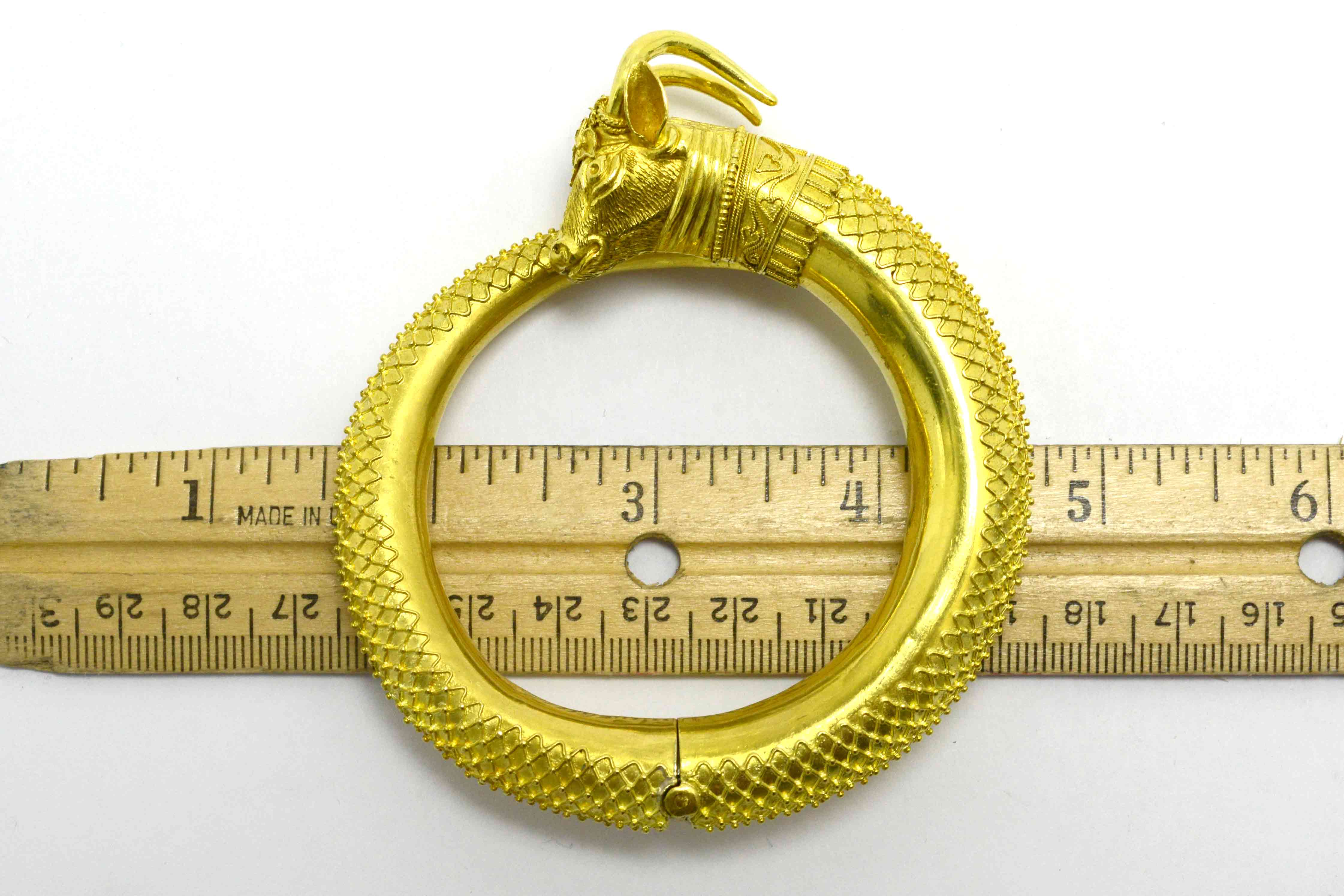 A rounded heavy, 22k high karat gold animal bracelet.