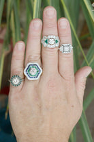 A collection of unique diamond and emerald platinum statement rings.