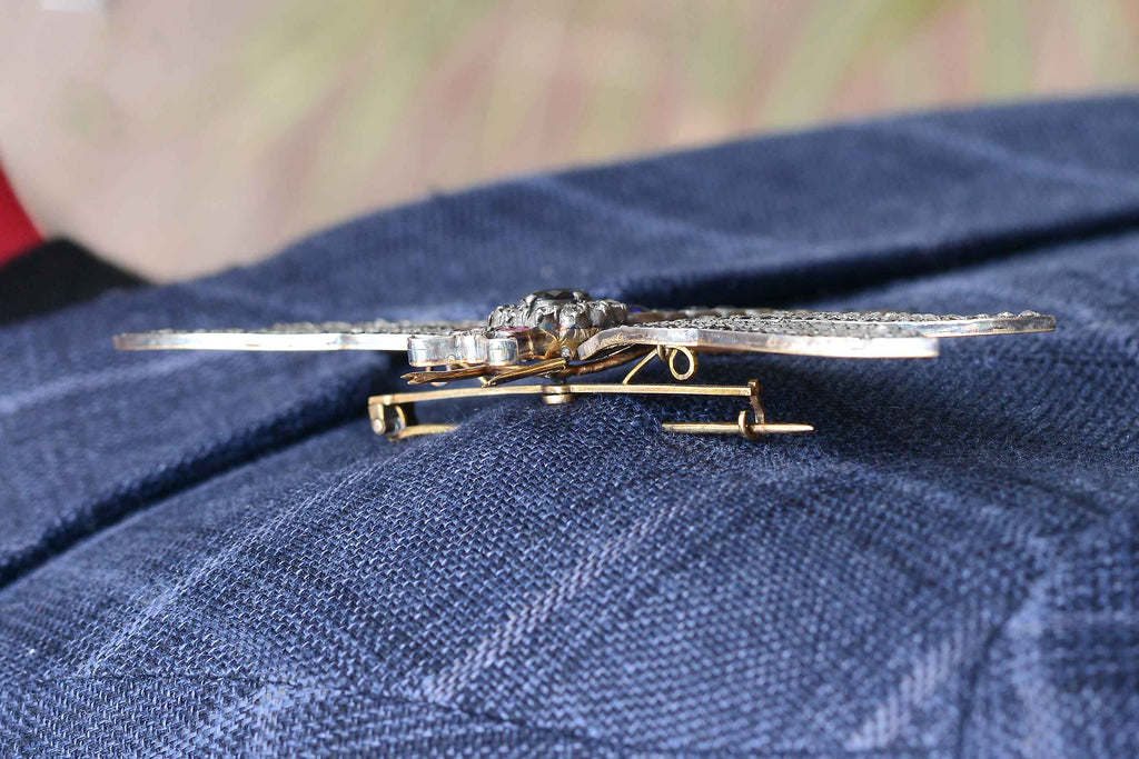 This Art Nouveau style dragonfly pin is securely attached to an adult sport coat.