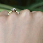Two tone gold diamond solitaire wedding ring.