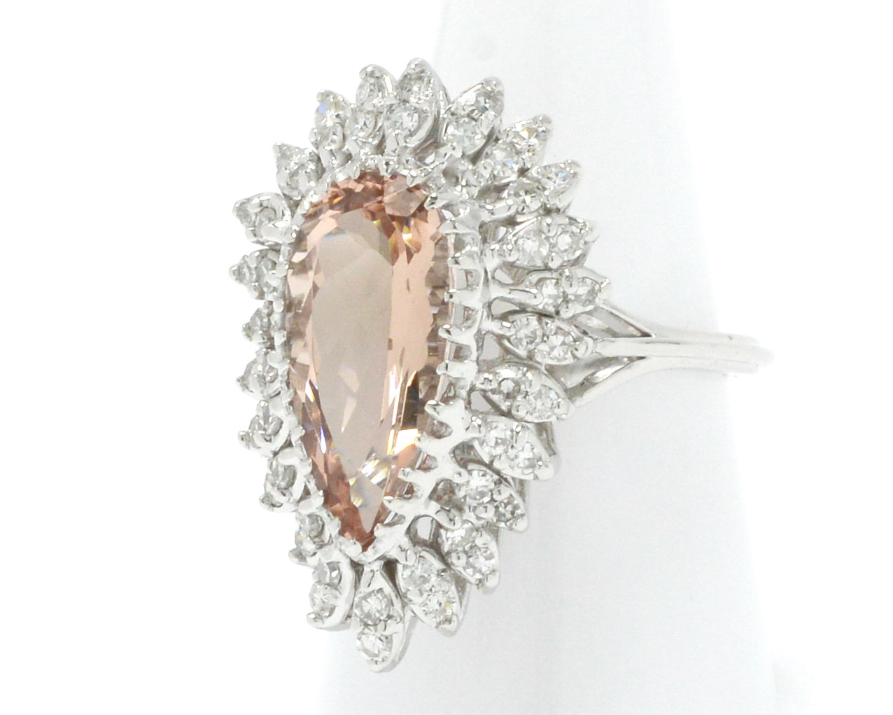 A 5 carat morganite modern estate ring with a halo of diamonds.