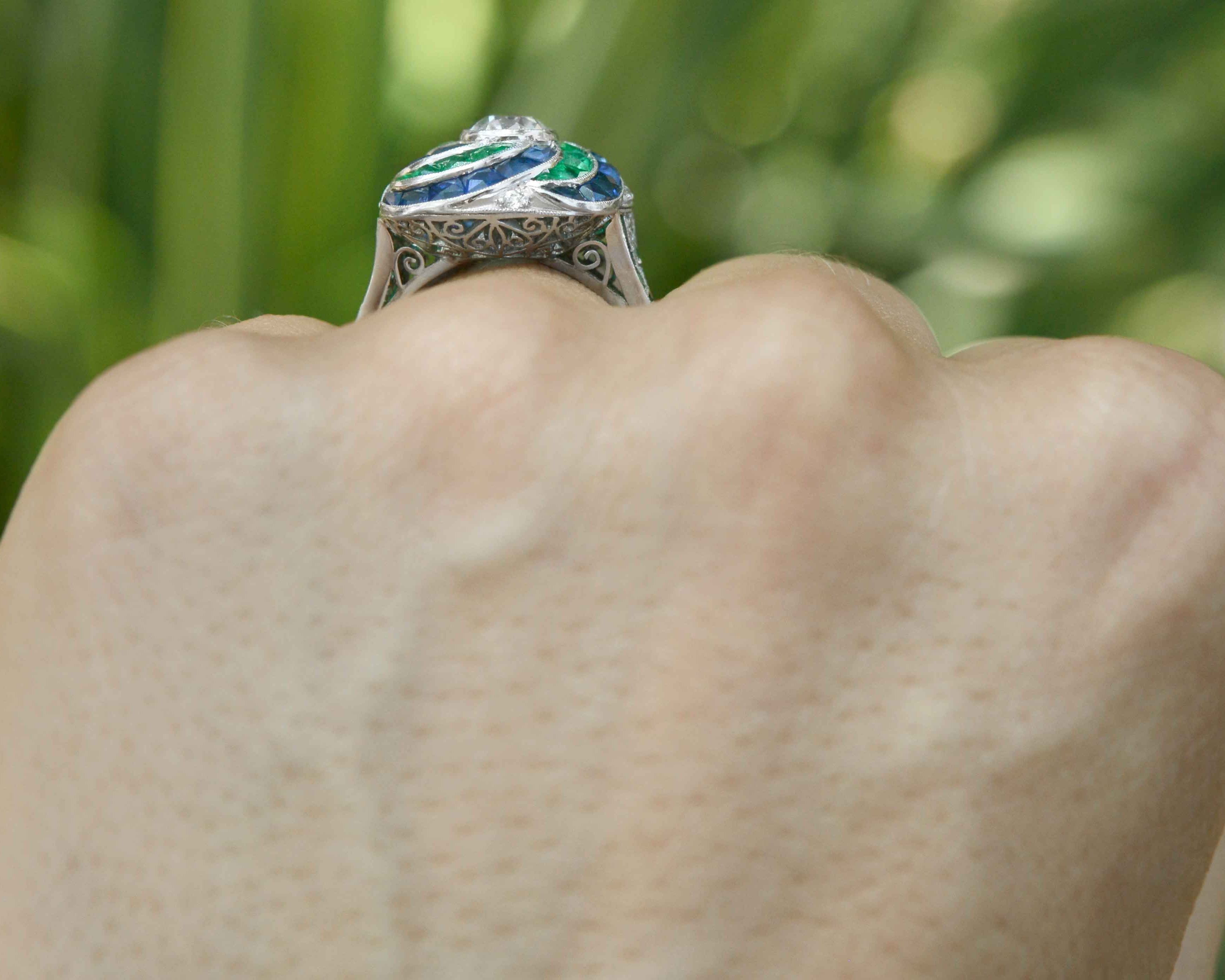 A unique one carat diamond platinum engagement ring with a filigree undergallery.