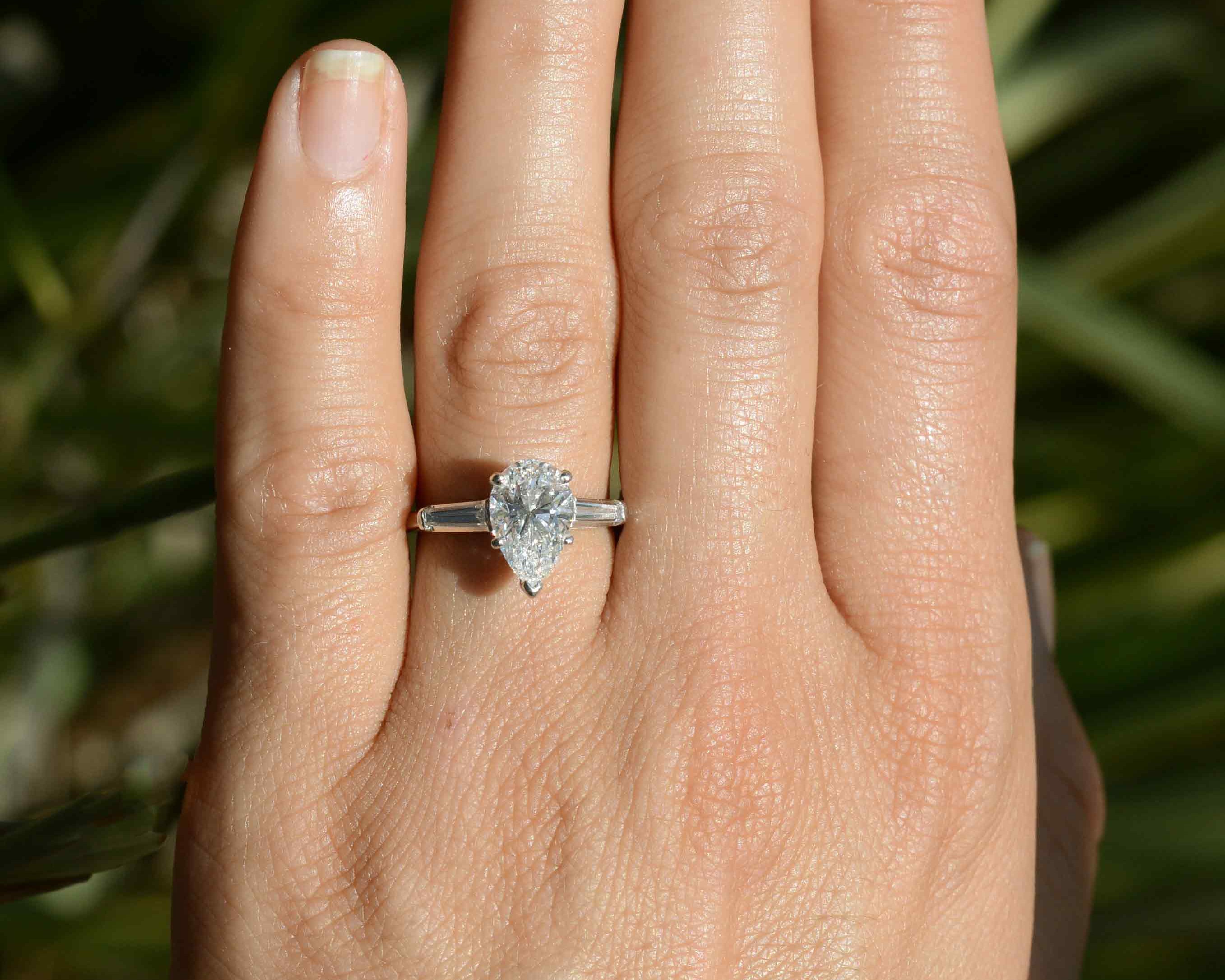 This pear diamond, set in a platinum solitaire, has excellent color and clarity.
