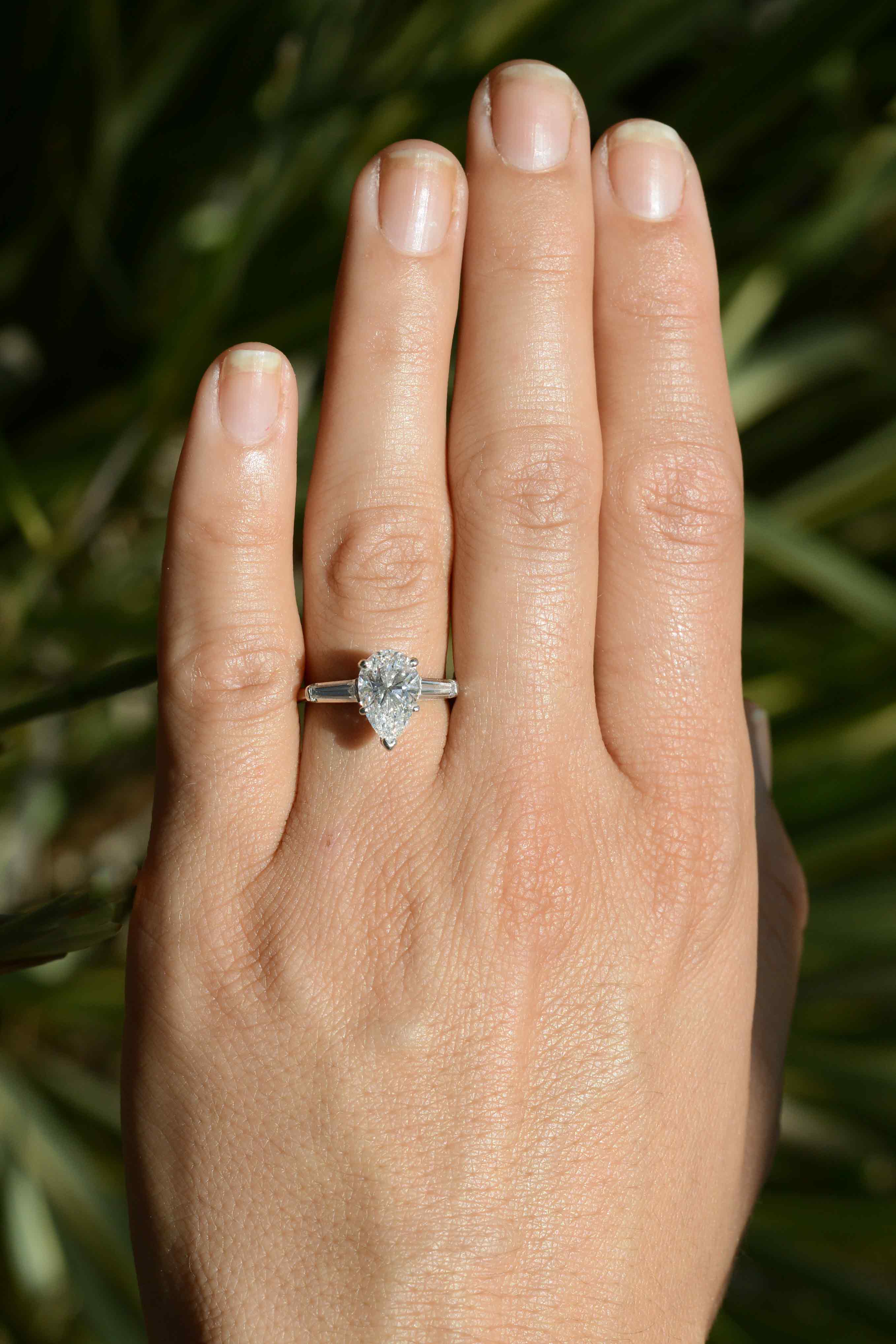This pear diamond, set in a platinum solitaire, has excellent color and clarity.