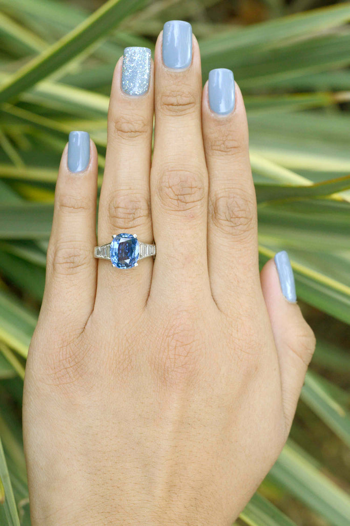 The blue ceylon sapphire in this antique engagement ring has a blue denim hue.