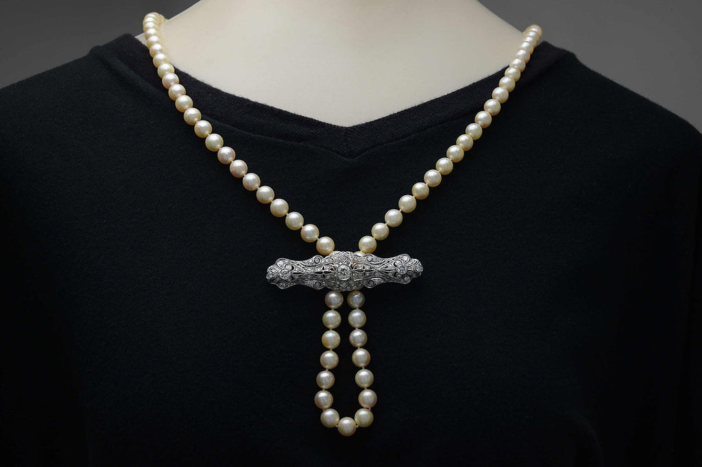Here is an example on how to string a pearl strand through this diamond brooch.