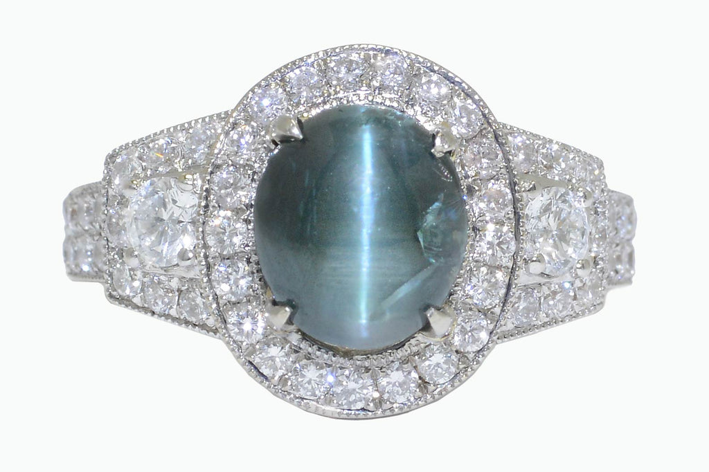 This engagement ring features a rare, color changing alexandrite gemstone.