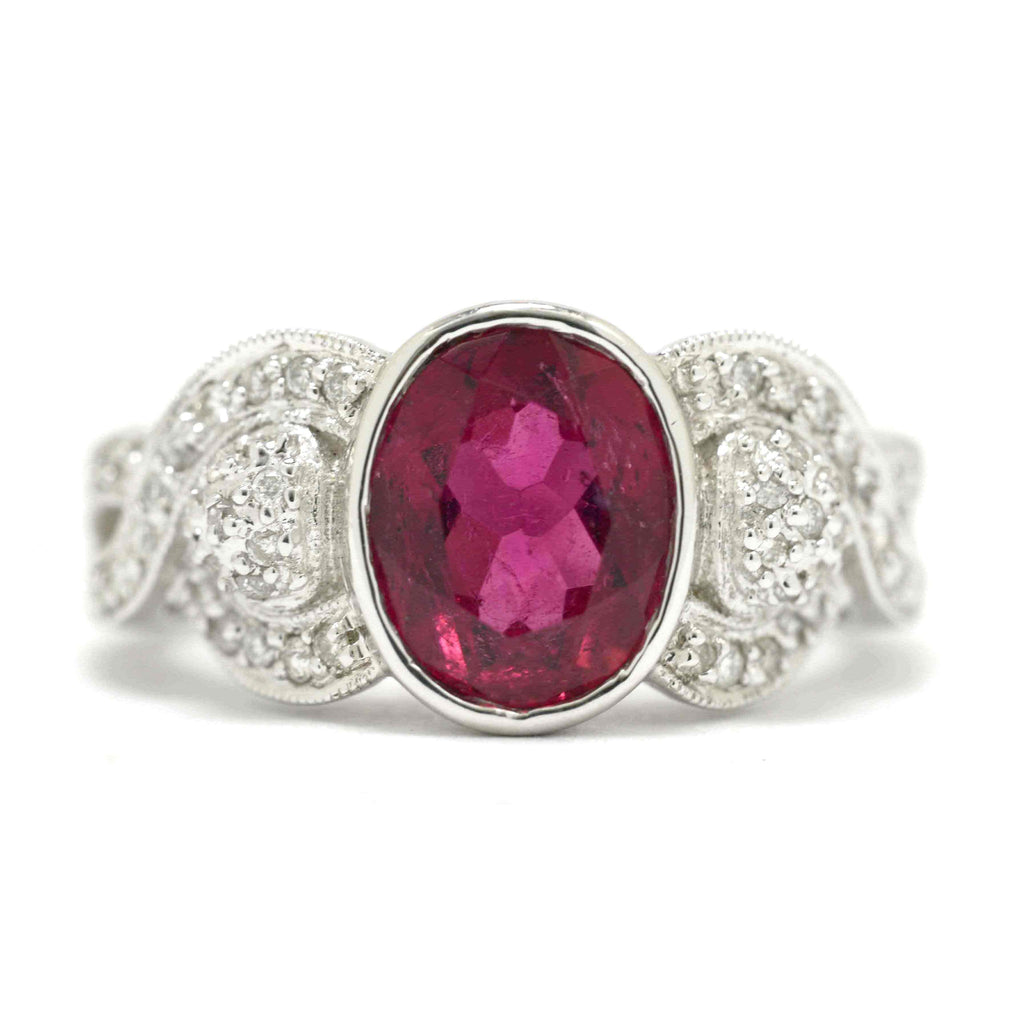 A retro oval pink tourmaline and diamonds engaegment ring.