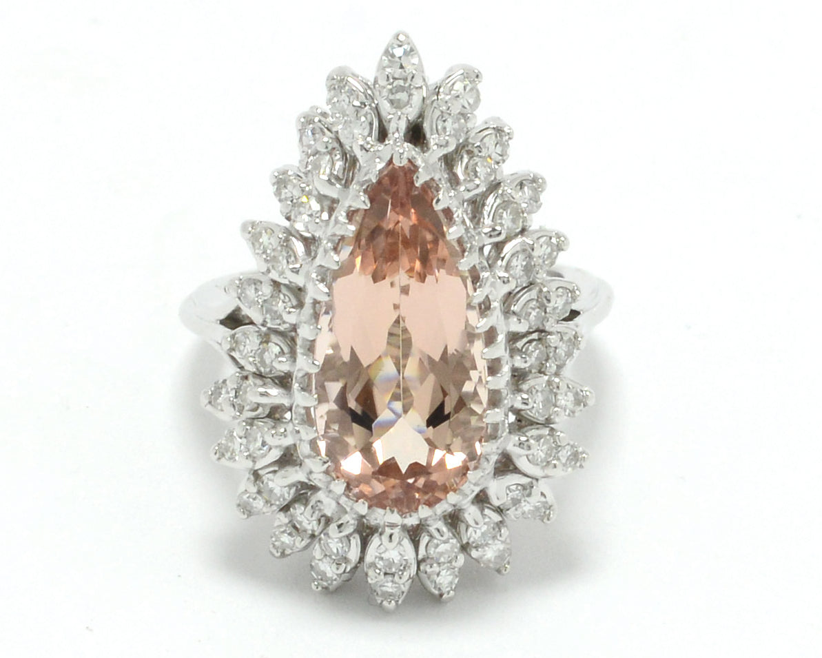 A natural, peach-colored morganite gemstone and diamonds statement ring.