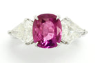 A heated, natural 2 carat cushion cut pink sapphire engagement ring.