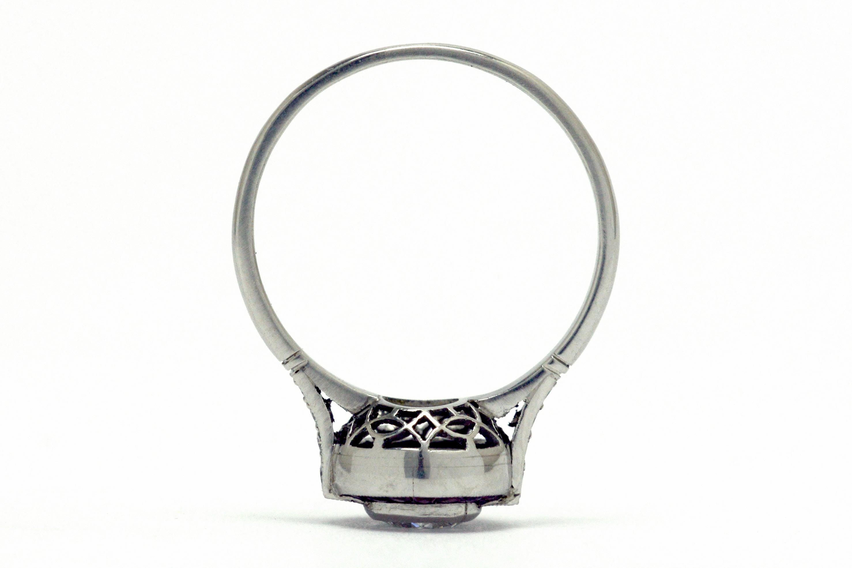 A platinum bezel diamond engagement ring design.