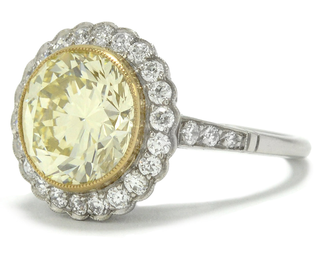 This platinum engagement ring is lined with an 18k gold bezel to support the 5 carat diamond.