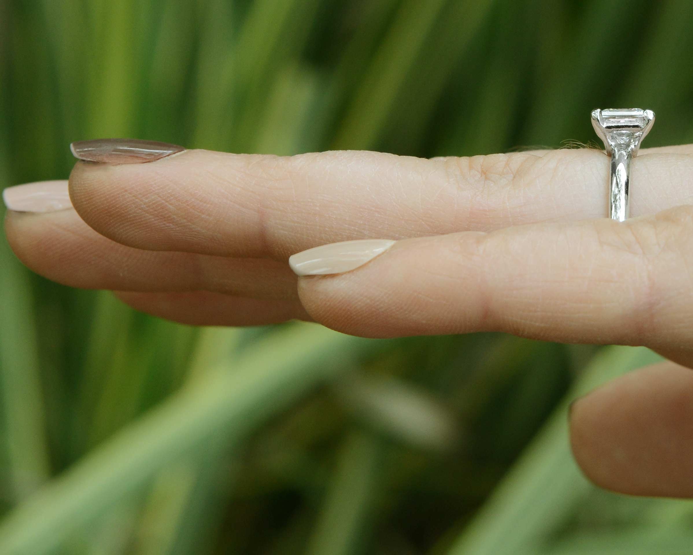 A simple, princess cut diamond solitaire engagement ring.