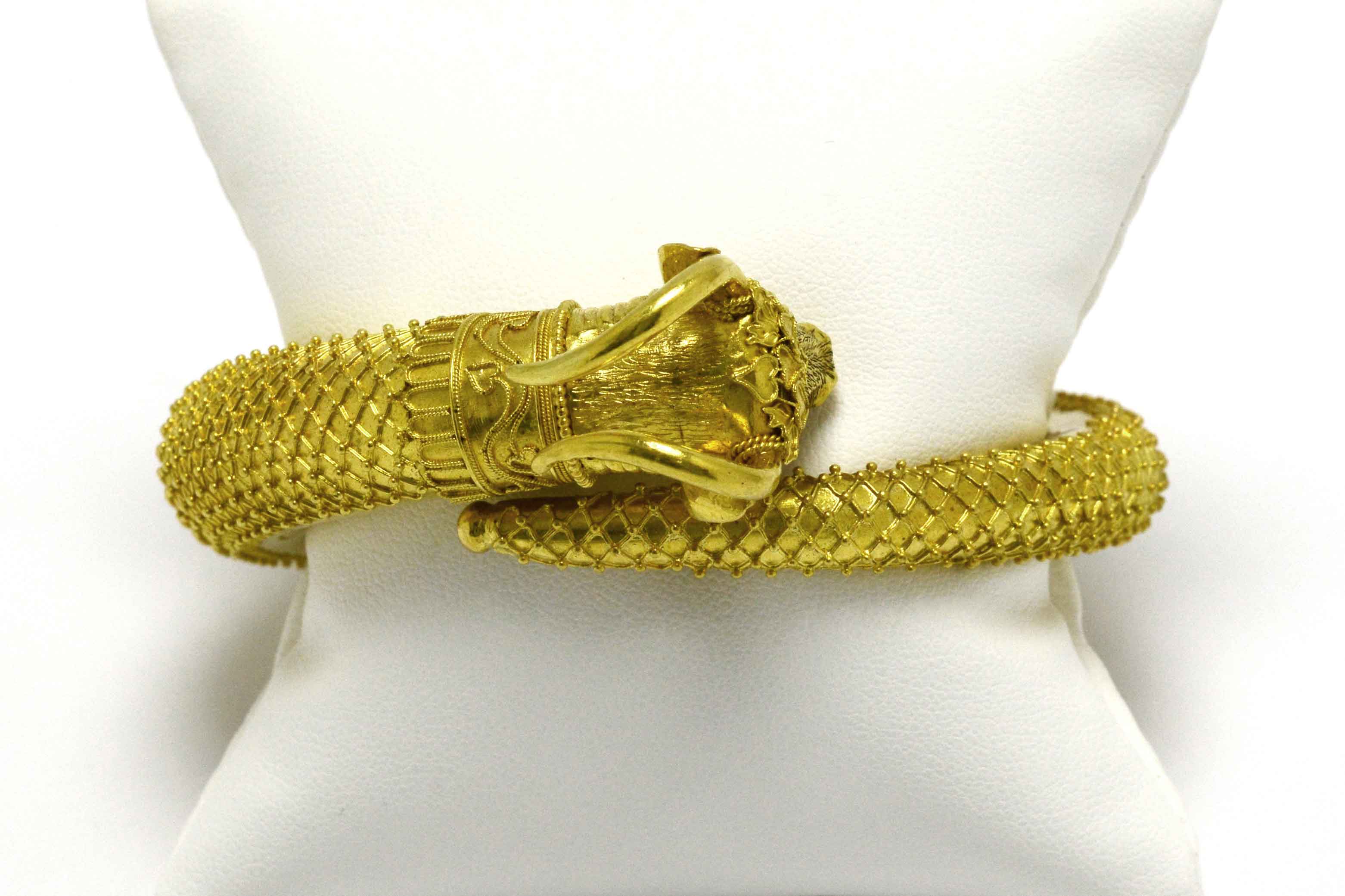 Gold horns raise above this unique, heavy 22k gold ram bracelet.