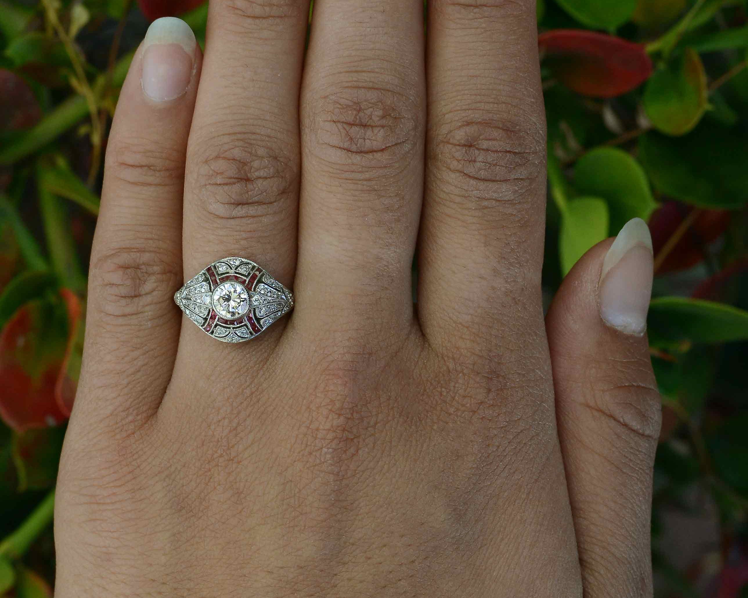Hand fabricated diamond engagement ring, accented by rubies.
