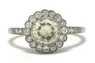 An Edwardian inspired diamond cluster engagement ring.