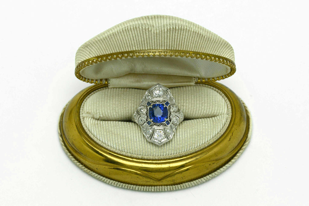 An Edwardian sapphire engagement ring from the early 1900s in a presentation box.
