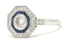 A round brilliant diamond, Art Deco revival octagon engagement ring.