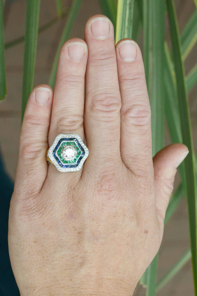 A large hexagon diamond, sapphire and emerald Art Deco statement ring.