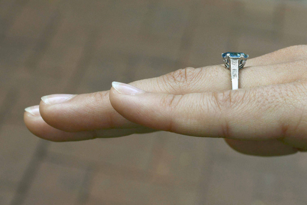 There is over 2 carats of natural diamonds and blue sapphire in this vintage solitaire ring.