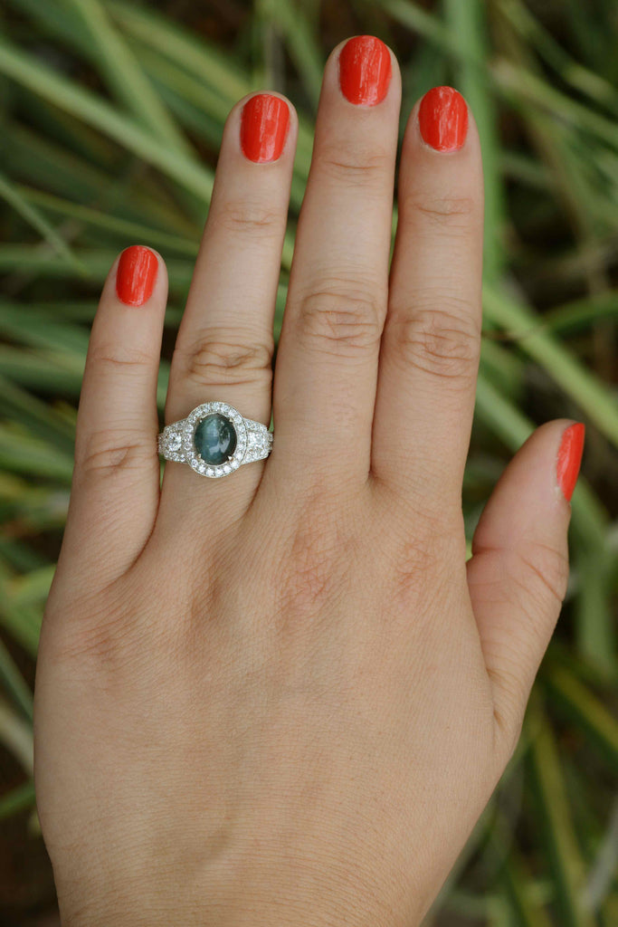 A unique cat's eye alexandrite and diamond target engagement ring.