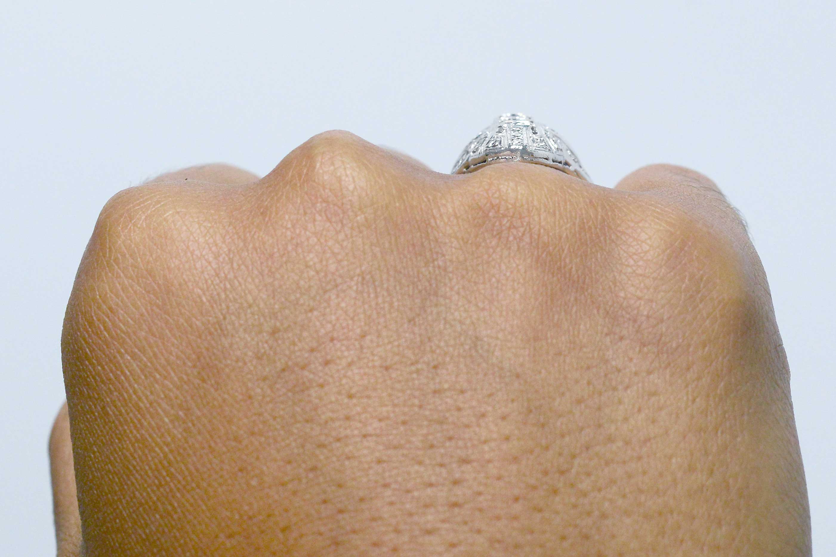 Filigree diamonds shield ring.
