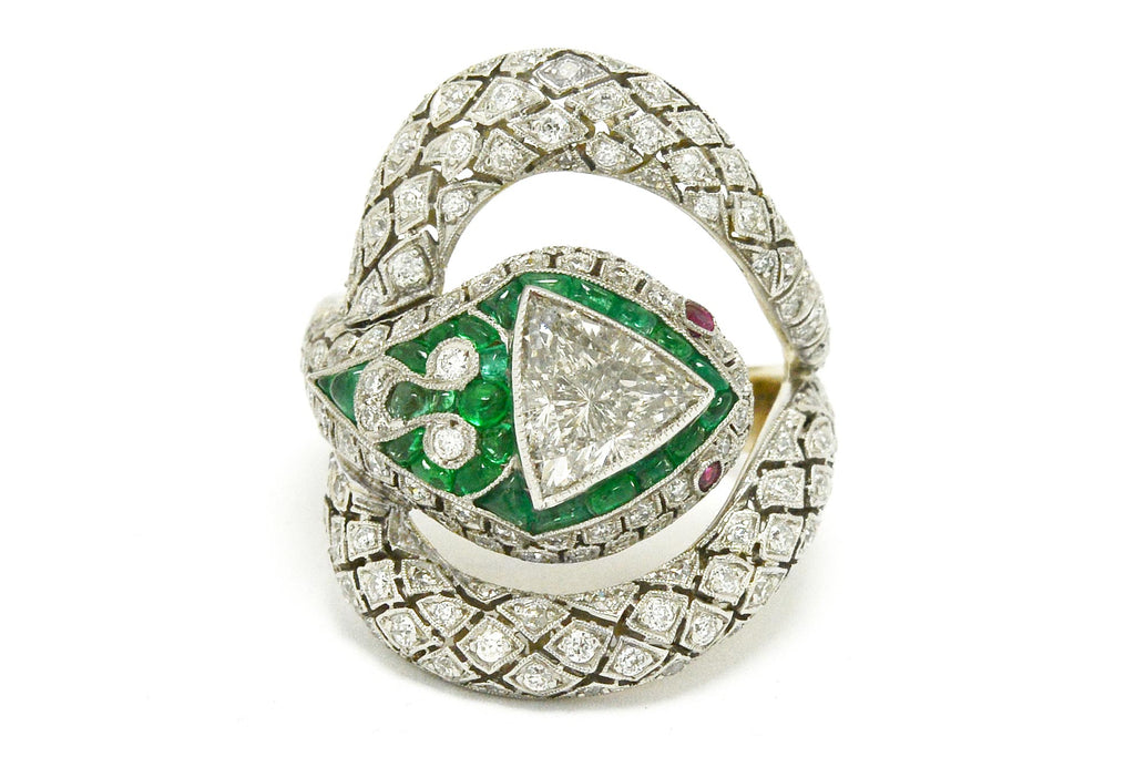 1 carat trillion cut diamond snake ring with emeralds and rubies.