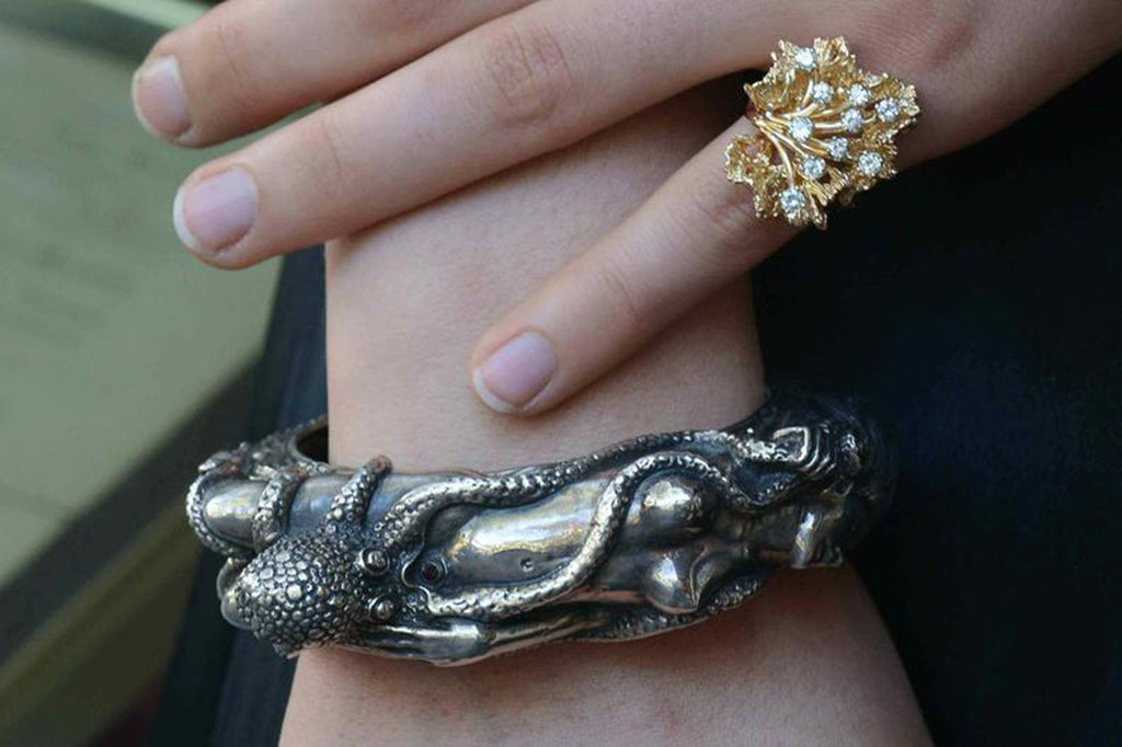 This nude woman silver bracelet design is based on the story, "the dream of the fisherman's wife".