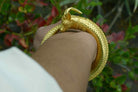 This high karat gold ram head bracelet shows great detail in the skin textures.