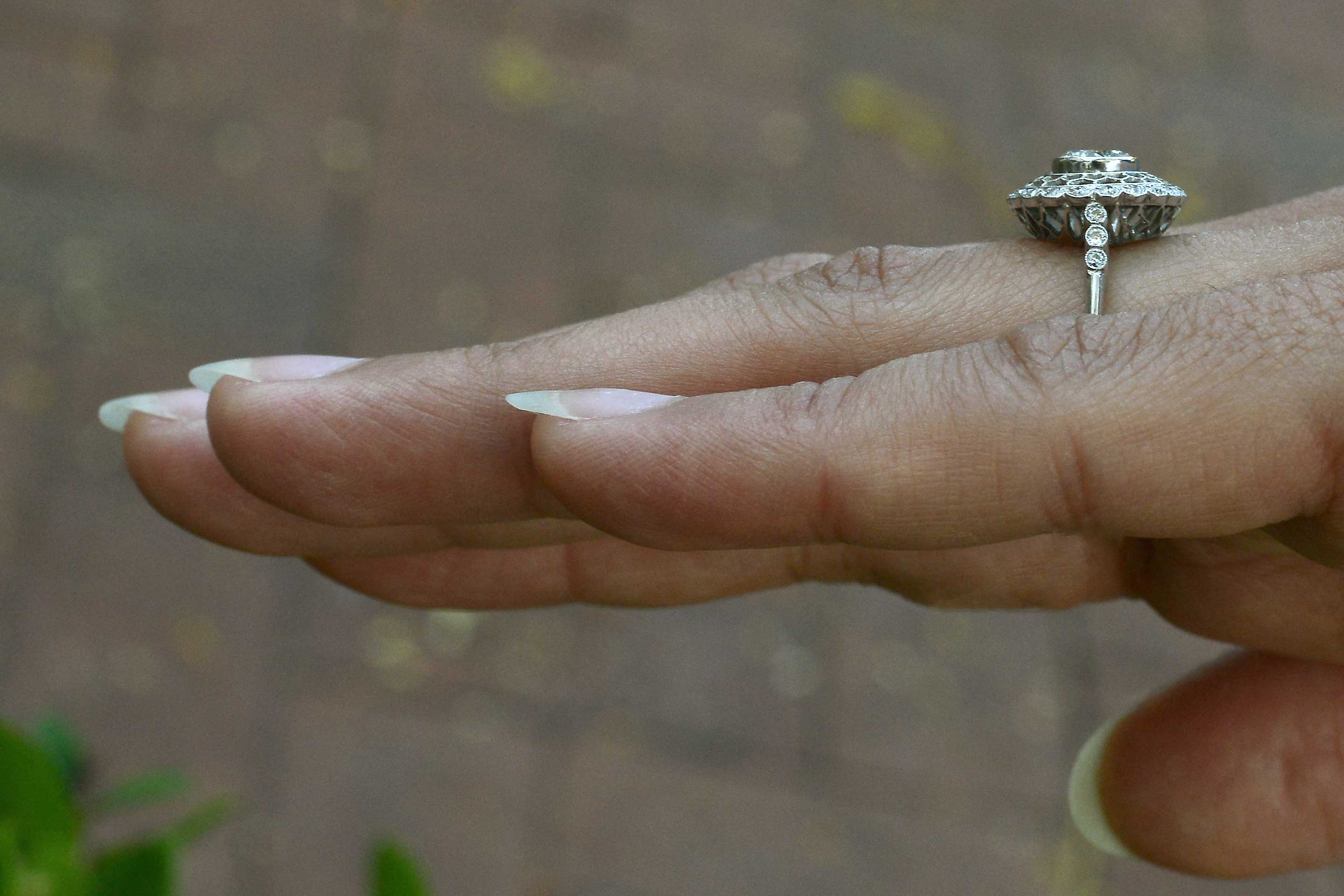 An Edwardian style laced halo diamond engagement ring.