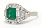 Step cut emerald and diamonds square Art Deco ring.