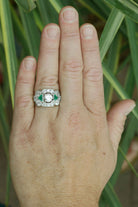 Diamond emerald cluster wedding ring.