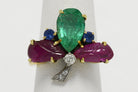A clover ring with diamonds, rubies, emeralds and blue sapphires.