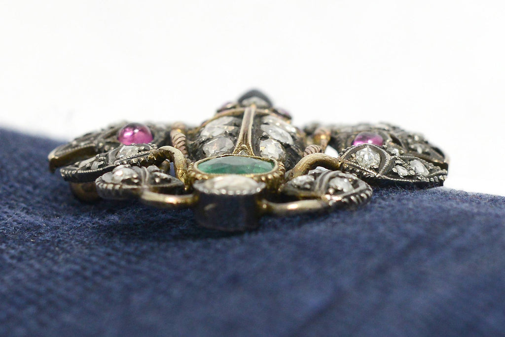 A diamond, ruby, sapphire and emerald scrab beetle brooch.