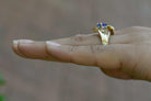 A violet blue tanzaite with good color saturation, set in a contemporary gold ring.