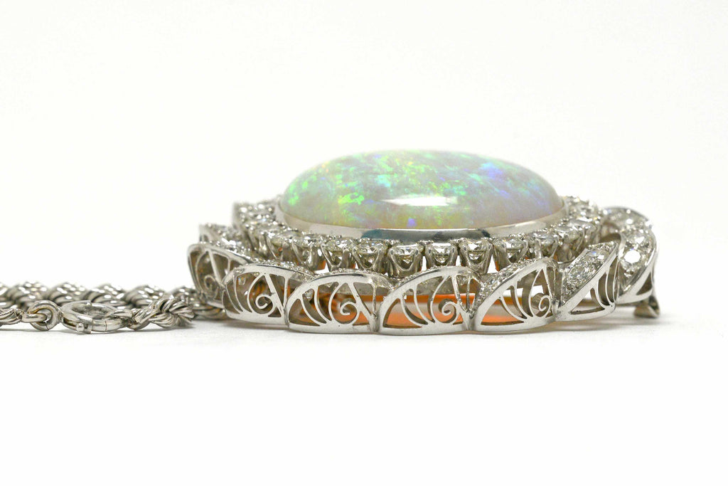 A 14k white gold 1960's diamond opal pendant necklace.