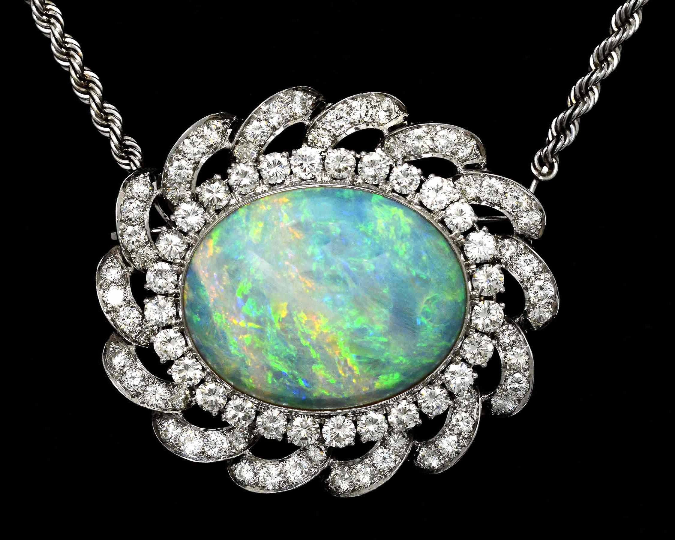 A 30 carat oval opal, white gold diamond halo pendant necklace.