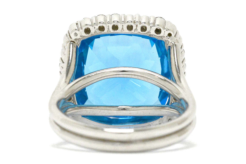 A vivid, swiss blue topaz in a 14k white gold ring setting.