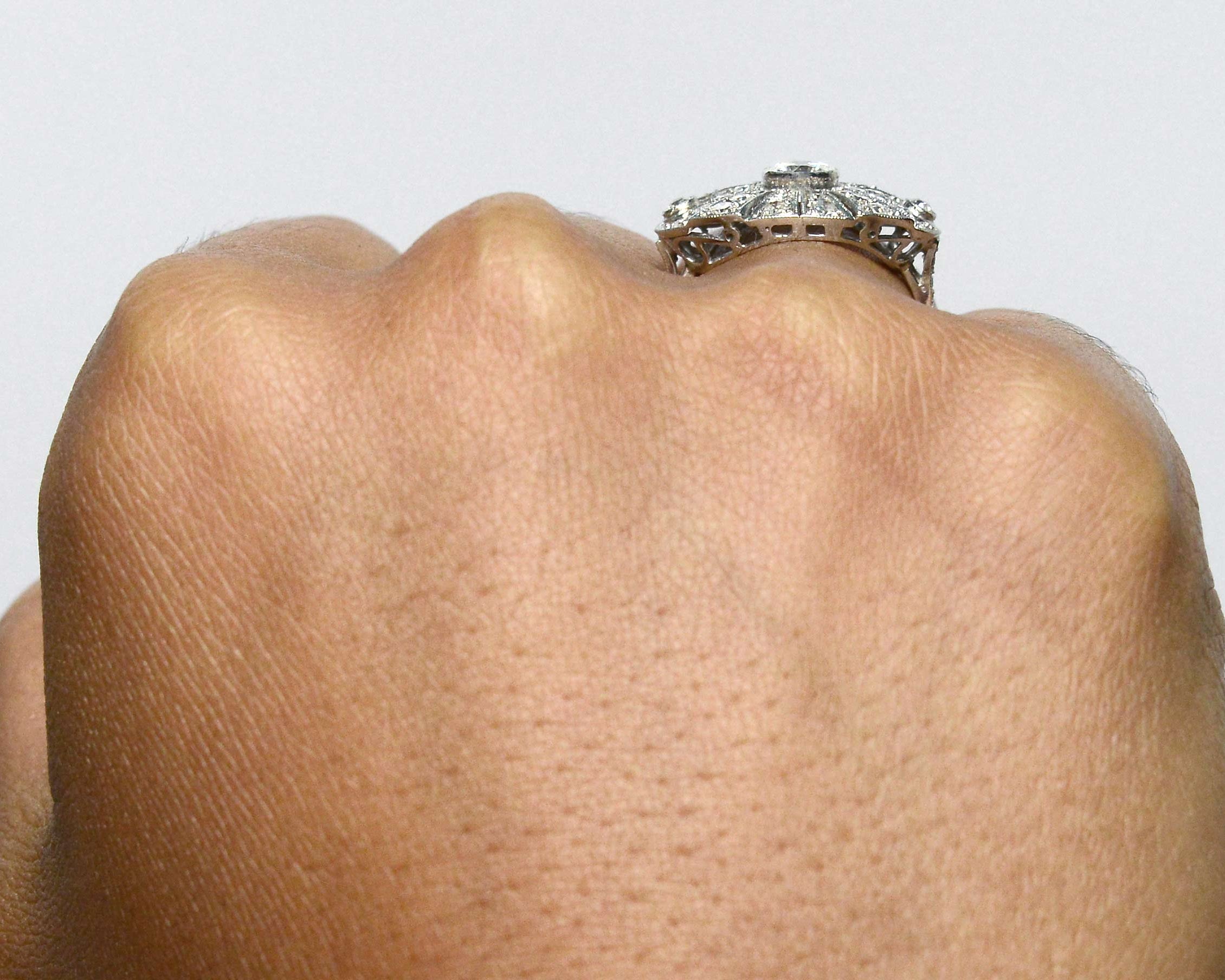 An oval shaped Art Deco sunburst, platinum diamond statement ring.